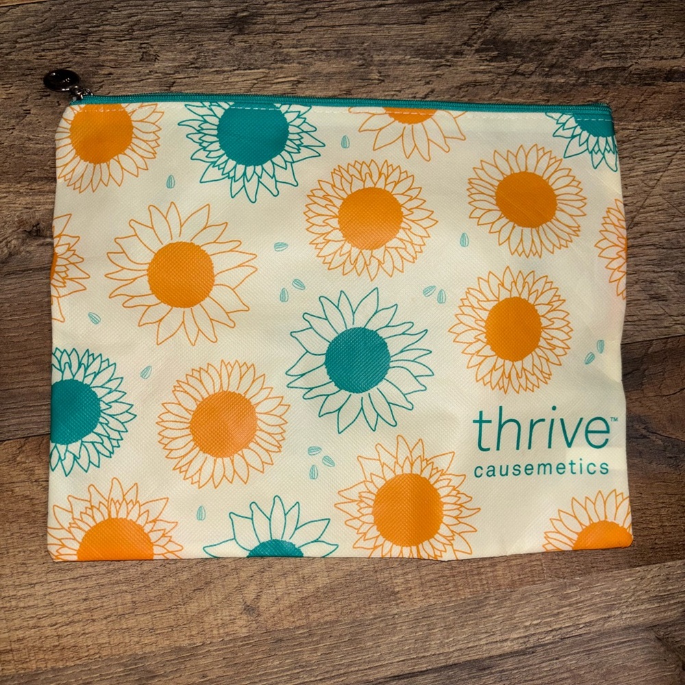 Thrive Causemetics Sunflower Cosmetic Bag with Teal and Orange